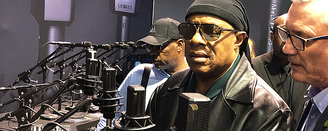 LEWITT booth at NAMM with Stevie Wonder testing the LCT 540 S