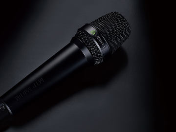 This image shows the MTP 550 DM live performance microphone on black background